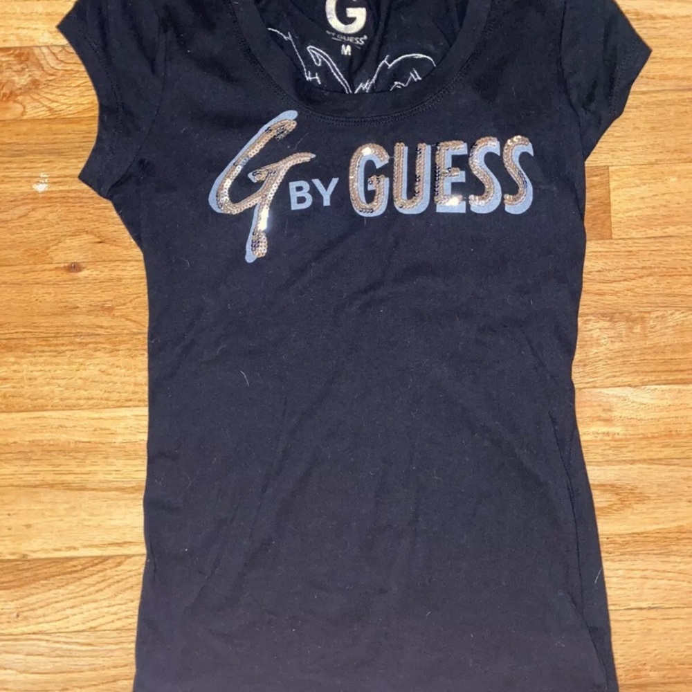 Guess shirt size medium with wings on the back
